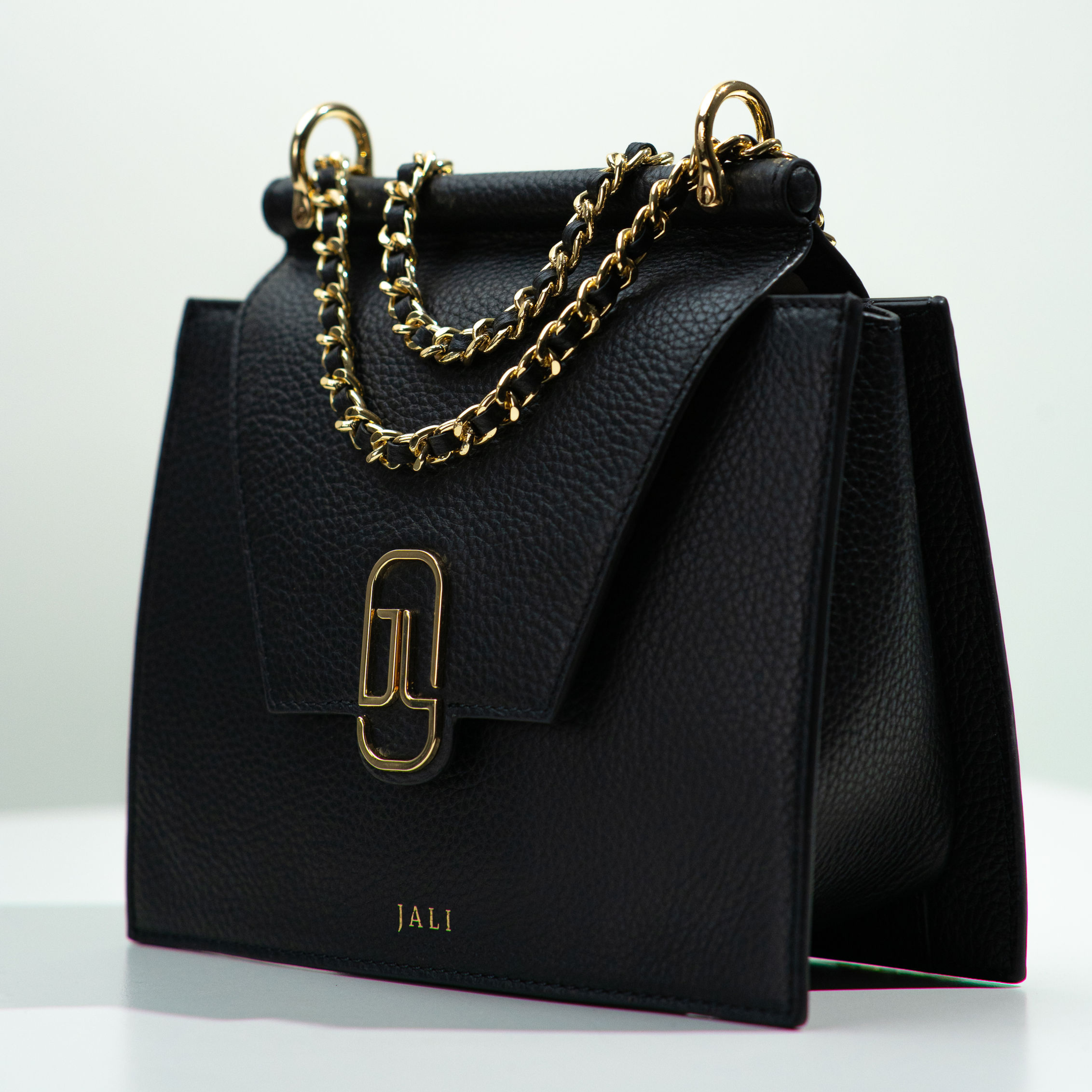 Inside view of Cleopatra Bag in Black by Jali, showing spacious 100% cotton biodegradable lining and gold-plated hardware – Australian luxury leather handbag